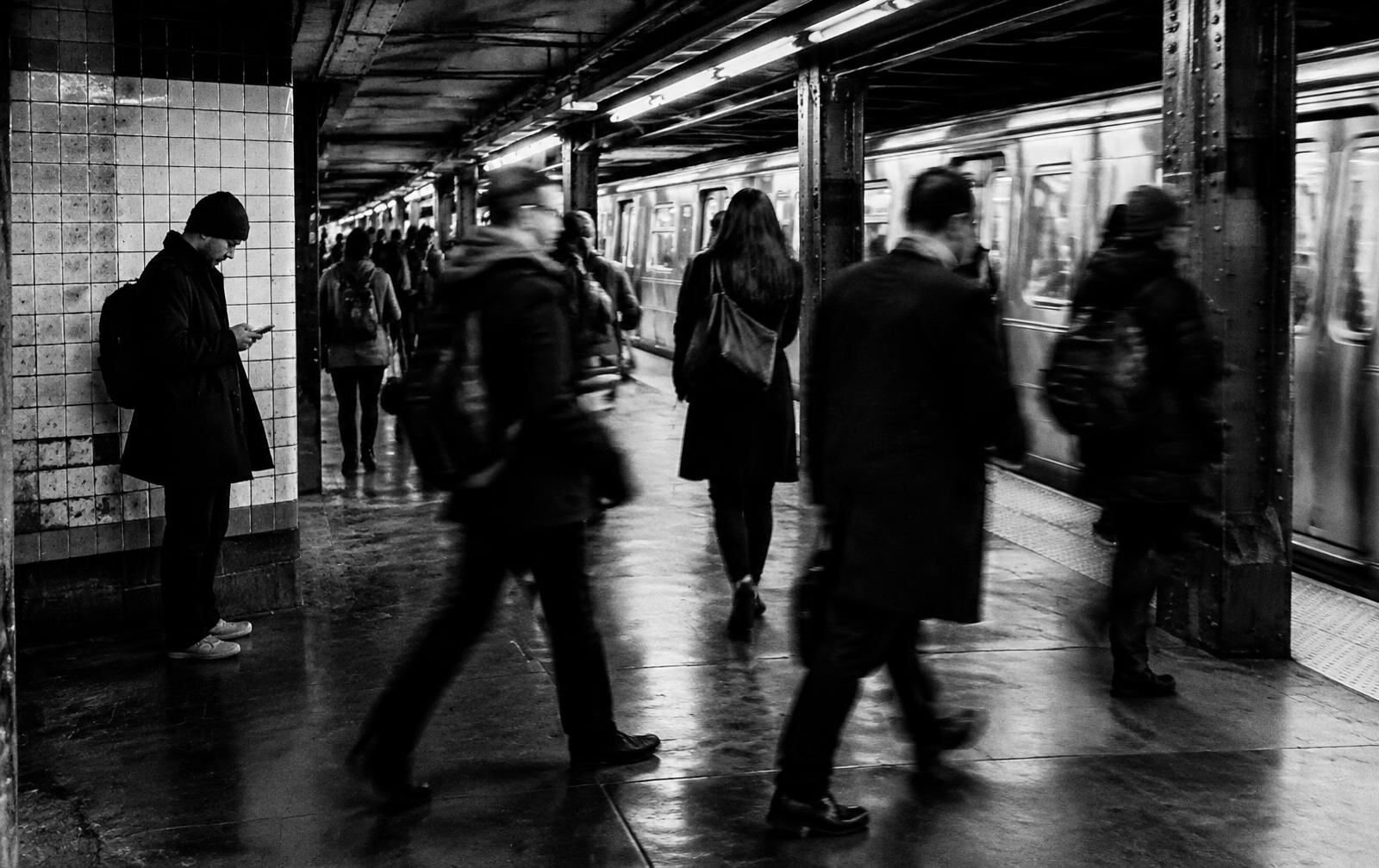 Commuters walking through a subway station